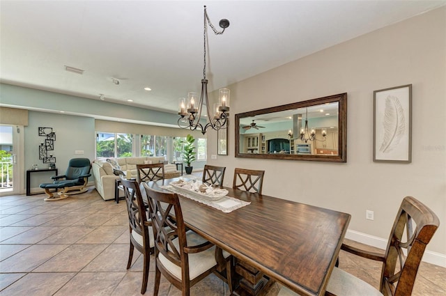 dining area with tile flooring and ceiling fan with notable chandelier