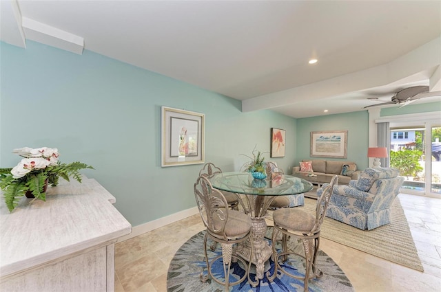 tiled dining room featuring ceiling fan