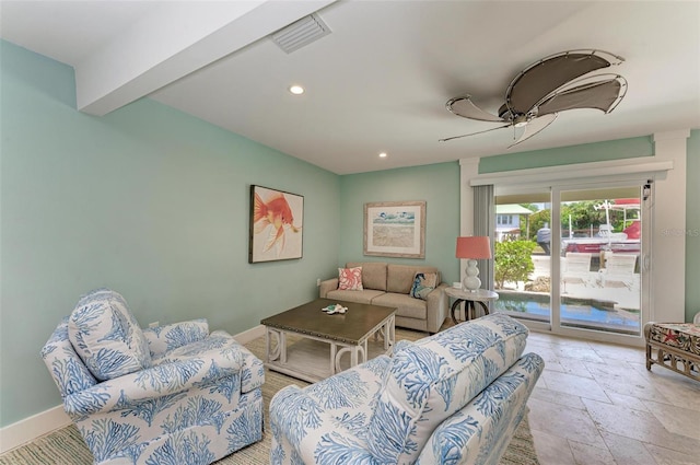 tiled living room featuring beamed ceiling