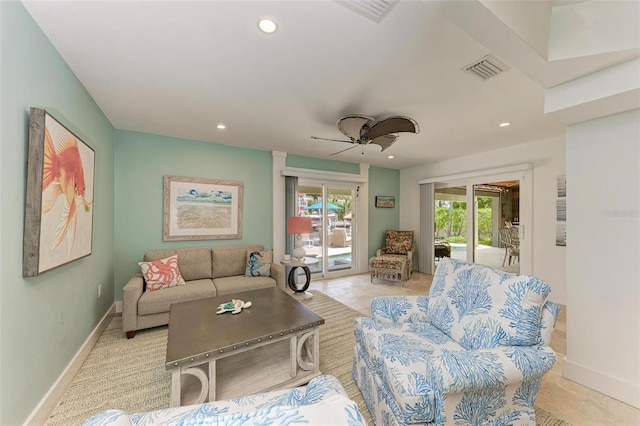 tiled living room with ceiling fan