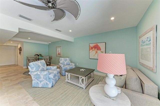 living room featuring tile floors and ceiling fan