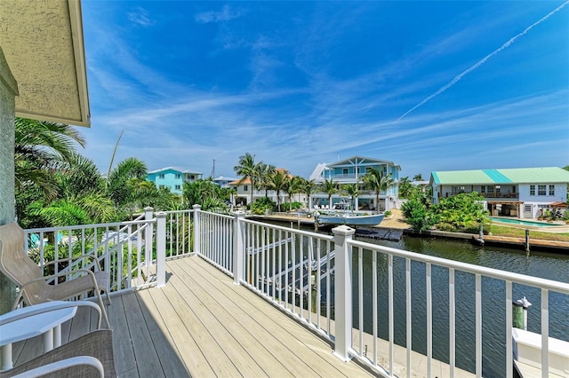 wooden terrace with a water view