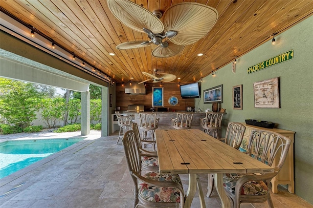 dining space featuring wood ceiling and ceiling fan