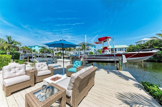 view of dock featuring a water view and an outdoor hangout area