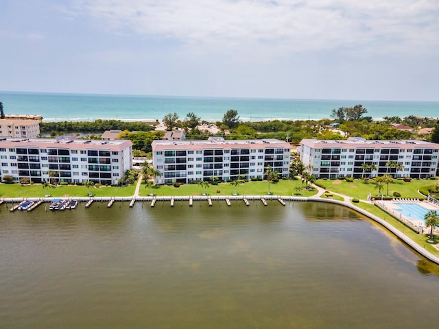 birds eye view of property featuring a water view