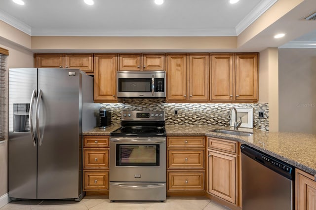 kitchen featuring stainless steel appliances, backsplash, and light tile floors