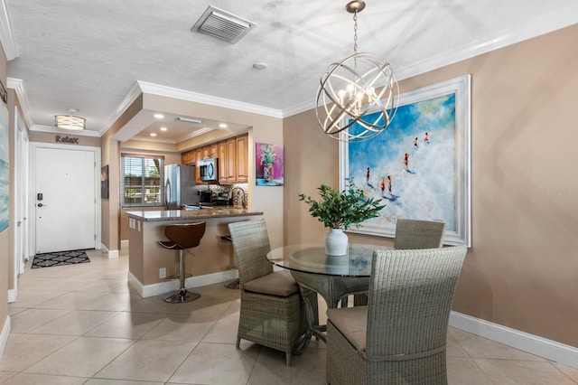 tiled dining area featuring a chandelier, a textured ceiling, and crown molding