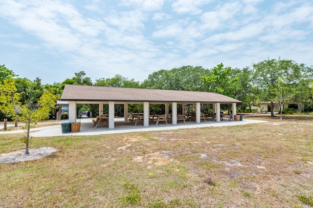 surrounding community with a patio area, a lawn, and a gazebo