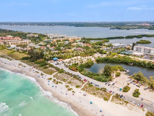 drone / aerial view featuring a view of the beach and a water view