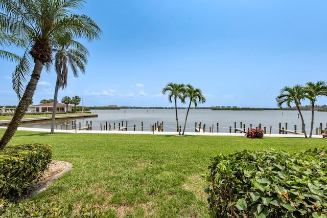 exterior space featuring a water view and a yard