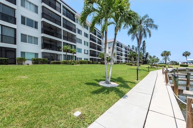 view of property's community with a lawn