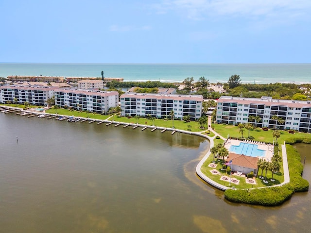 birds eye view of property with a water view