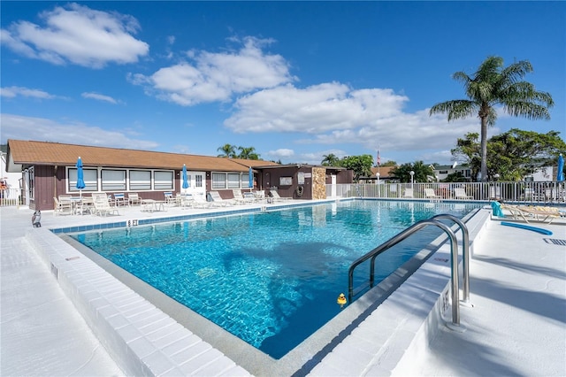 view of swimming pool with a patio area