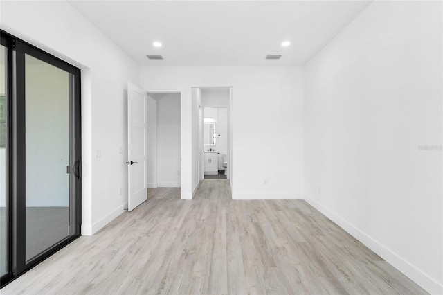 unfurnished bedroom featuring recessed lighting, visible vents, baseboards, and light wood-style floors