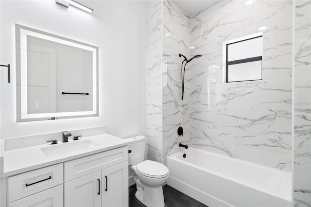 full bathroom with toilet, tiled shower / bath, and vanity