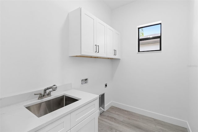 washroom with light hardwood / wood-style flooring, hookup for a washing machine, sink, cabinets, and electric dryer hookup