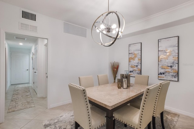 dining room with a notable chandelier, light tile flooring, and crown molding