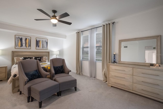 carpeted bedroom featuring ceiling fan and ornamental molding