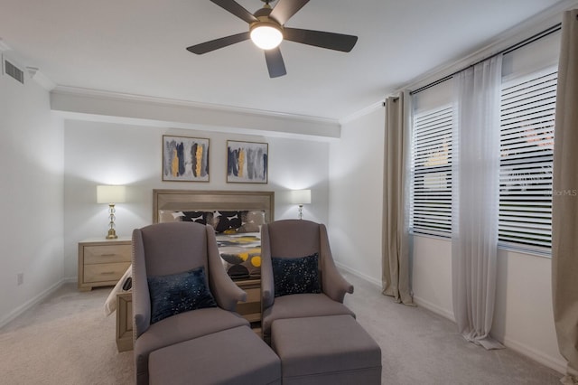 carpeted bedroom featuring ornamental molding and ceiling fan