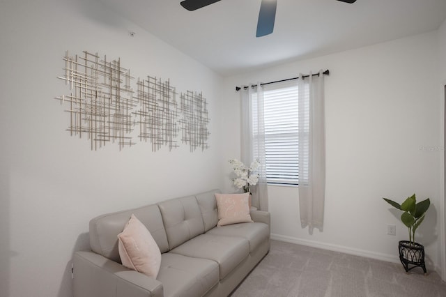 living room featuring ceiling fan and carpet flooring