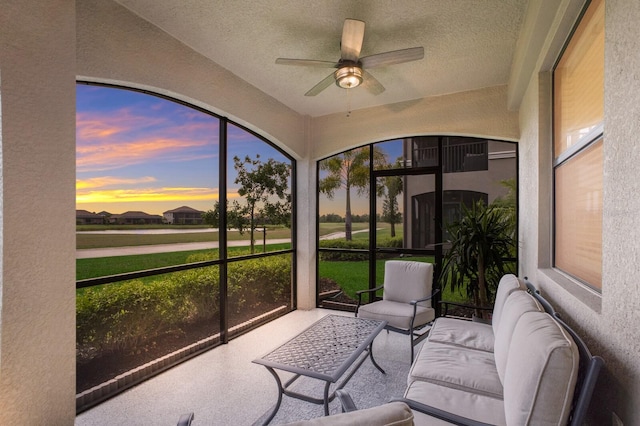 sunroom / solarium with ceiling fan