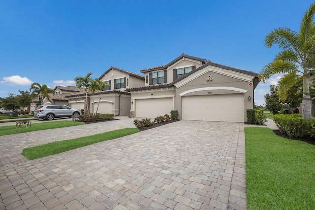 view of front property with a garage and a front yard