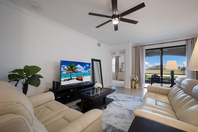 living room featuring ornamental molding and ceiling fan