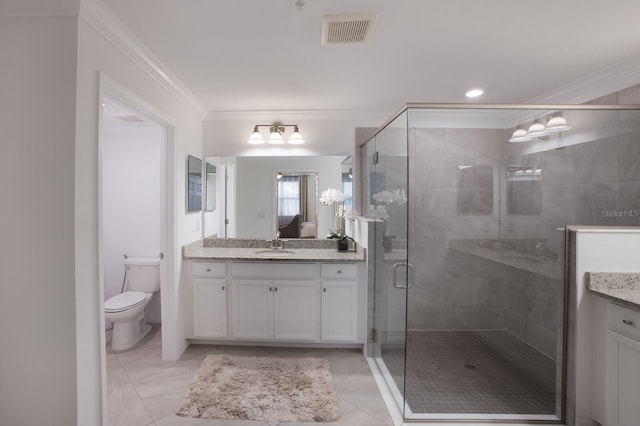 bathroom featuring crown molding, tile flooring, vanity, and toilet