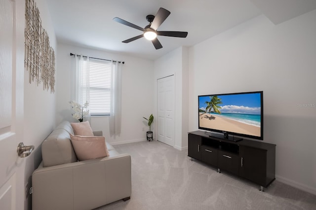 living room featuring ceiling fan and light carpet