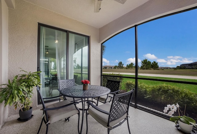 sunroom / solarium with ceiling fan