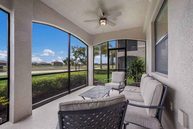 sunroom / solarium with ceiling fan