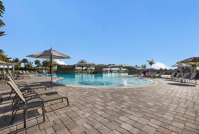 view of pool featuring a patio and pool water feature