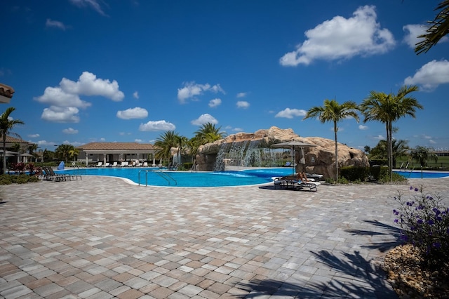 view of pool featuring a patio area and pool water feature