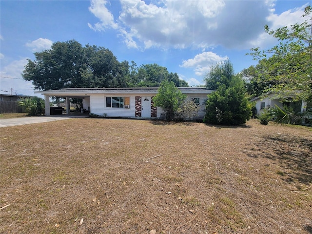 ranch-style house featuring a carport