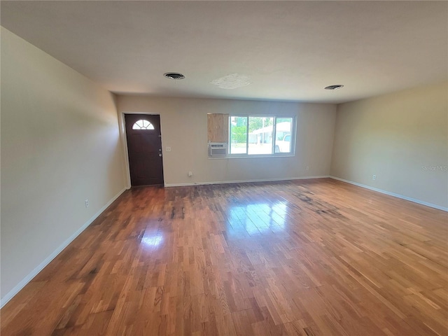 empty room featuring hardwood / wood-style floors