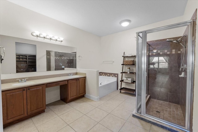 bathroom with shower with separate bathtub, tile patterned floors, and vanity