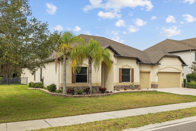 view of front facade with a garage and a front yard