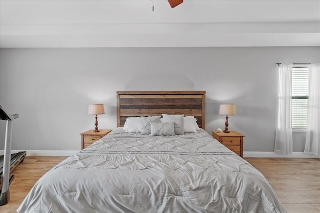 bedroom with light wood-type flooring and ceiling fan