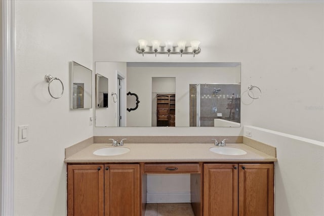 bathroom featuring walk in shower and vanity