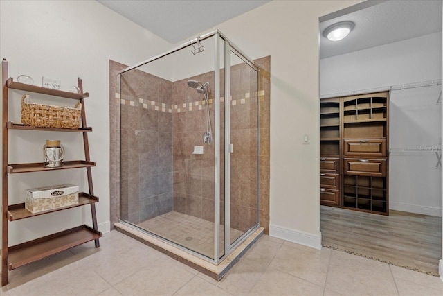 bathroom featuring tile patterned floors and walk in shower