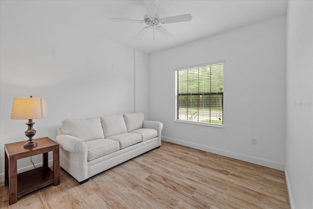 living area featuring ceiling fan and light wood-type flooring