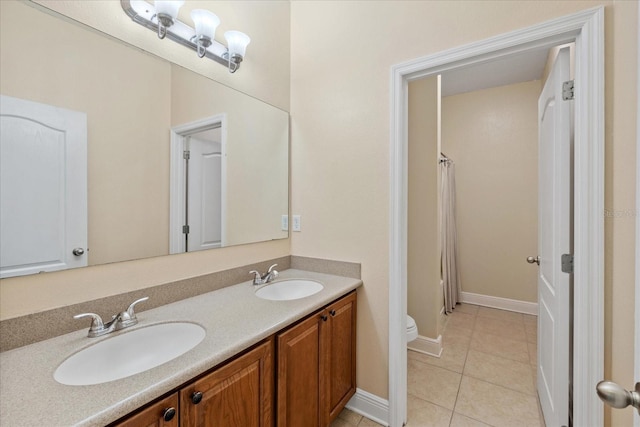 bathroom featuring toilet, tile patterned flooring, a shower with shower curtain, and vanity