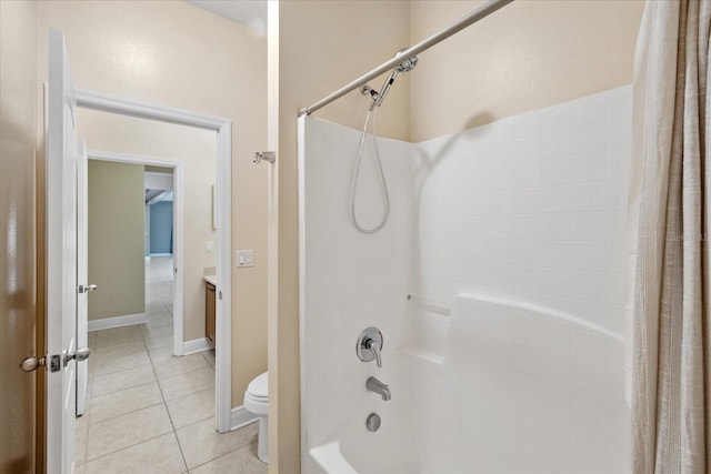 full bathroom featuring tile patterned floors, shower / tub combo with curtain, vanity, and toilet