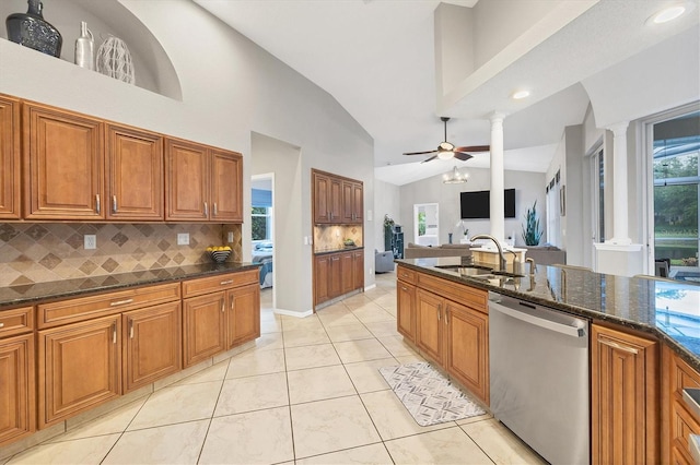 kitchen with dark stone counters, ceiling fan, dishwasher, and backsplash