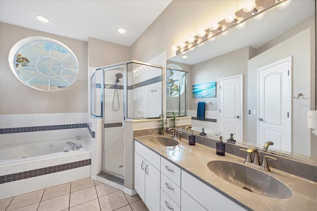 bathroom featuring tile floors, dual bowl vanity, and separate shower and tub