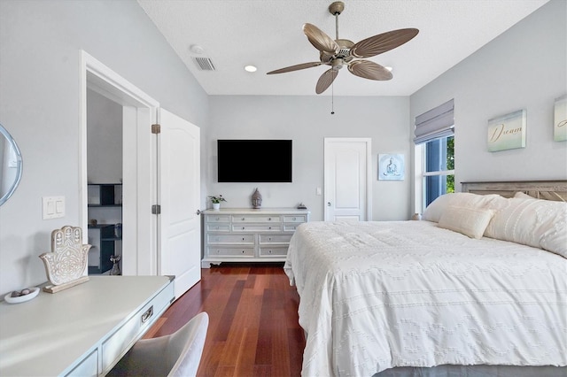 bedroom featuring dark wood-type flooring and ceiling fan