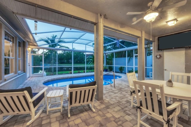 view of swimming pool featuring ceiling fan