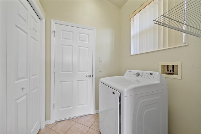 laundry area with light tile patterned flooring and washer / clothes dryer