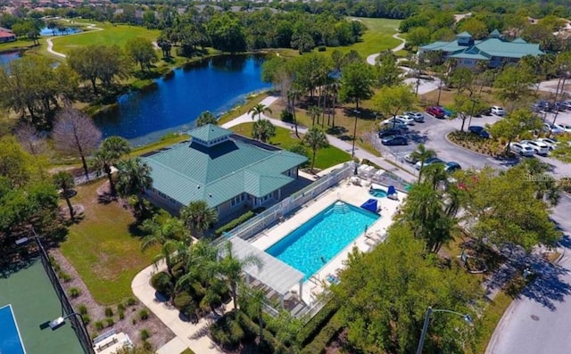 birds eye view of property with a water view