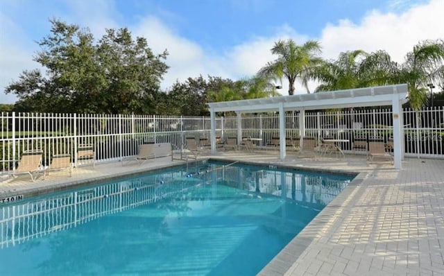 view of swimming pool featuring a patio area